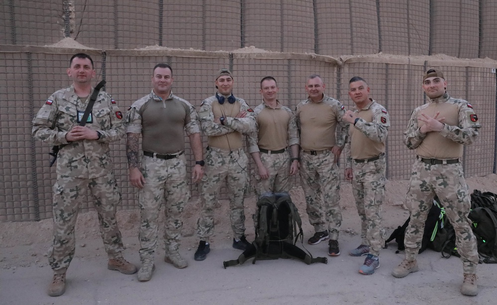 U.S. Soldiers and Coalition partners conduct Norwegian Ruck March at Al Asad Air Base, Iraq