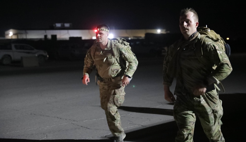 U.S. Soldiers and Coalition partners conduct Norwegian Ruck March at Al Asad Air Base, Iraq