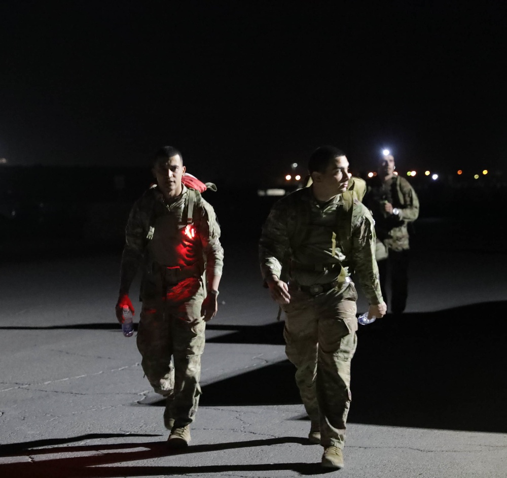 U.S. Soldiers and Coalition partners conduct Norwegian Ruck March at Al Asad Air Base, Iraq