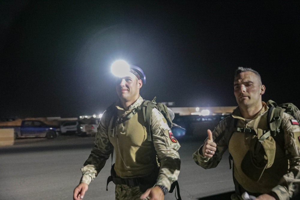 U.S. Soldiers and Coalition partners conduct Norwegian Ruck March at Al Asad Air Base, Iraq