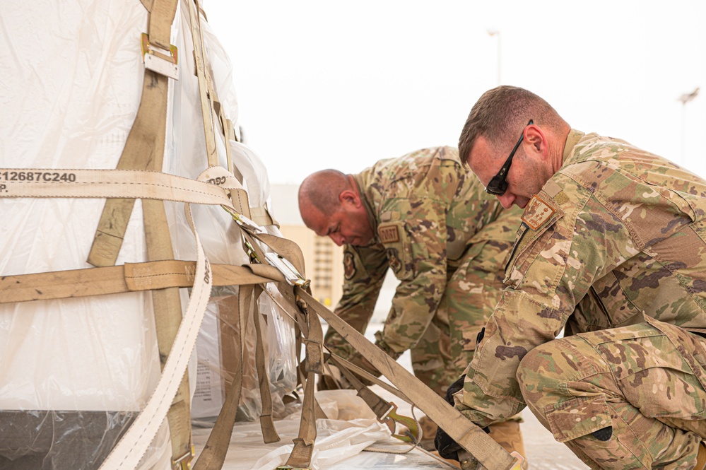 Roll Sleeves Up - 378th AEW leadership help out at Aerial Port