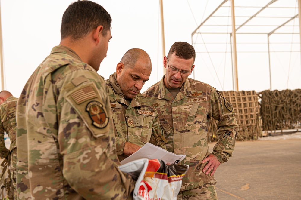 Roll Sleeves Up - 378th AEW leadership help out at Aerial Port