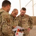 Roll Sleeves Up - 378th AEW leadership help out at Aerial Port