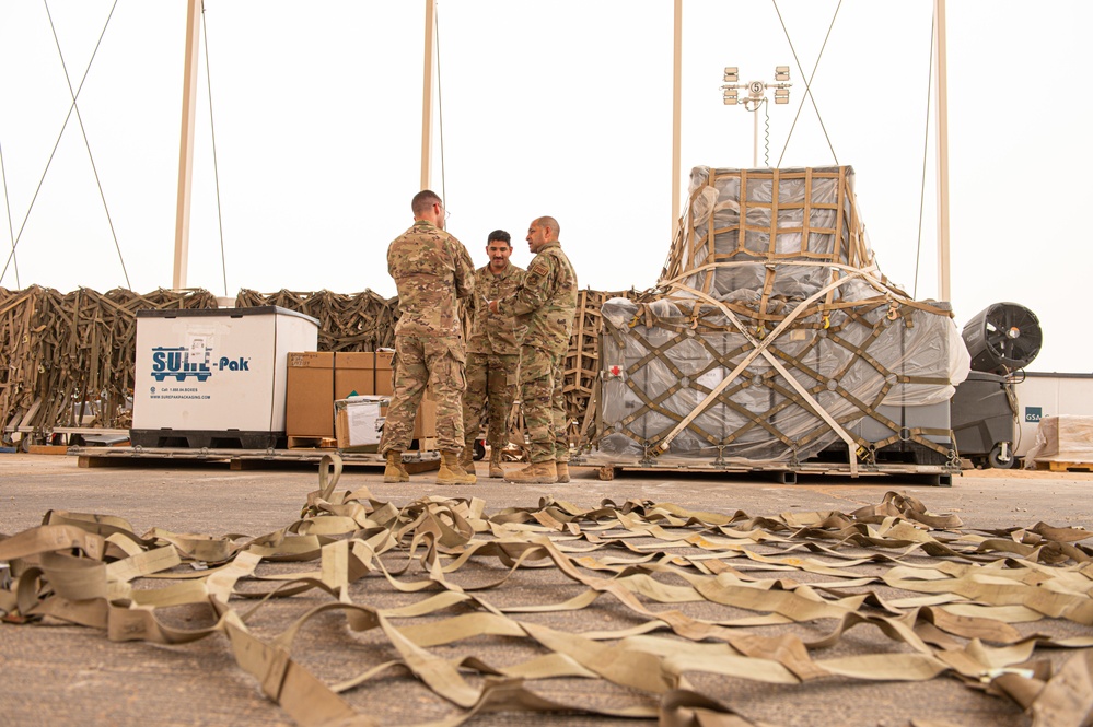 Roll Sleeves Up - 378th AEW leadership help out at Aerial Port