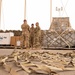 Roll Sleeves Up - 378th AEW leadership help out at Aerial Port