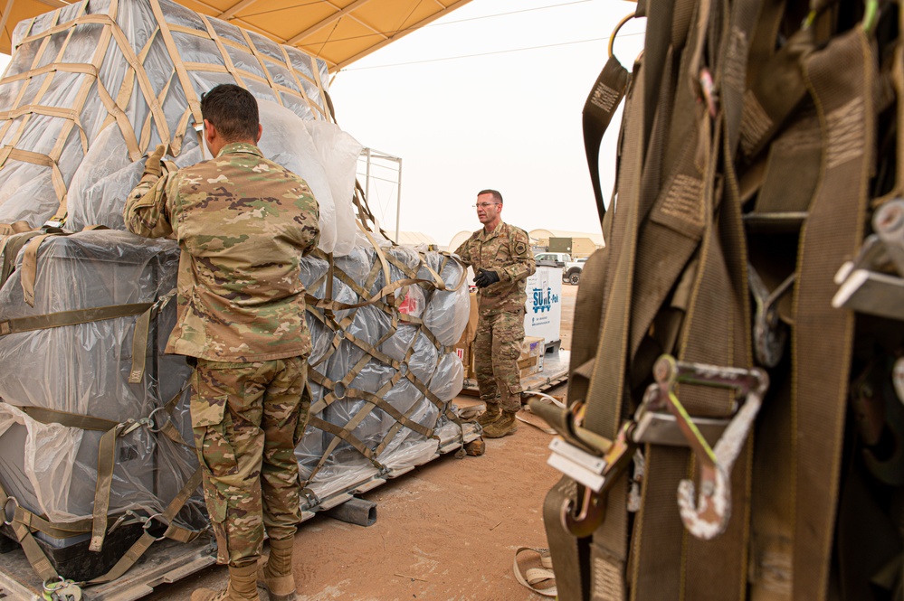 Roll Sleeves Up - 378th AEW leadership help out at Aerial Port