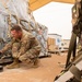 Roll Sleeves Up - 378th AEW leadership help out at Aerial Port