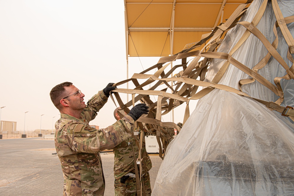 Roll Sleeves Up - 378th AEW leadership help out at Aerial Port