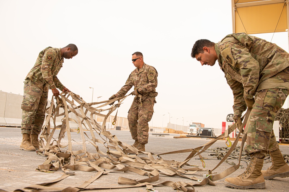 Roll Sleeves Up - 378th AEW leadership help out at Aerial Port