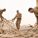 Roll Sleeves Up - 378th AEW leadership help out at Aerial Port