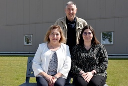 Benelux family poses in front of garrison headquarters