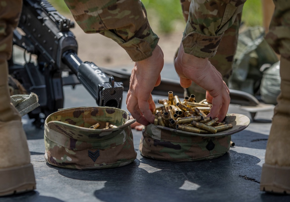 An Army Reserve Soldier uses the Army Patrol Cap to collect empty shell casings