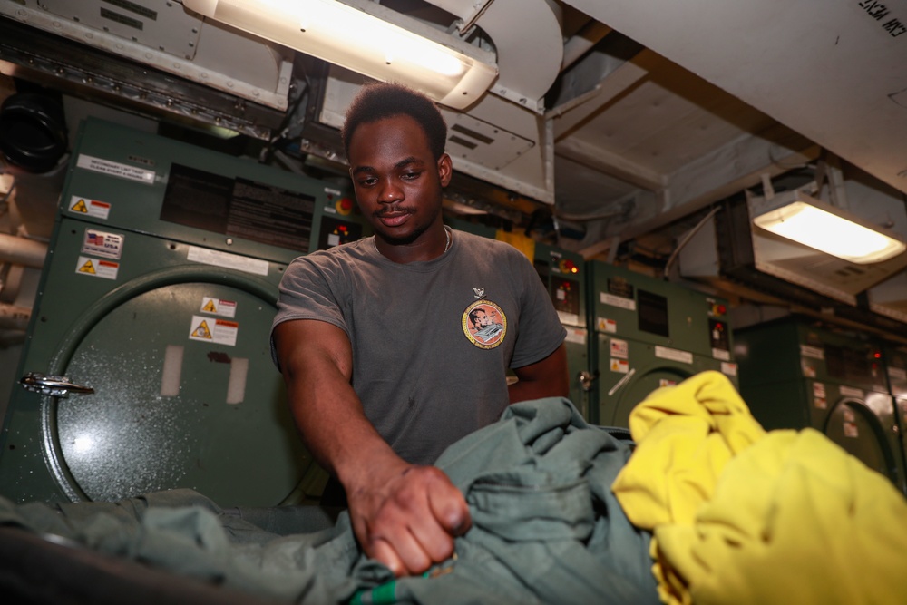 Abraham Lincoln Sailors restock ship's store