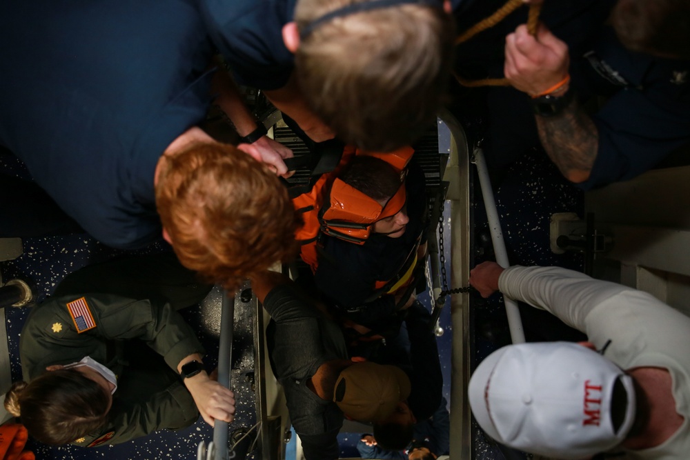 Sailors perform a simulated medevac