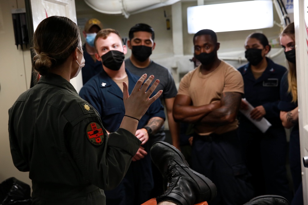 Sailors perform a simulated medevac