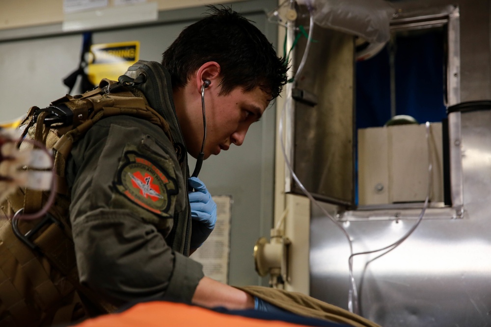 Sailors perform a simulated medevac