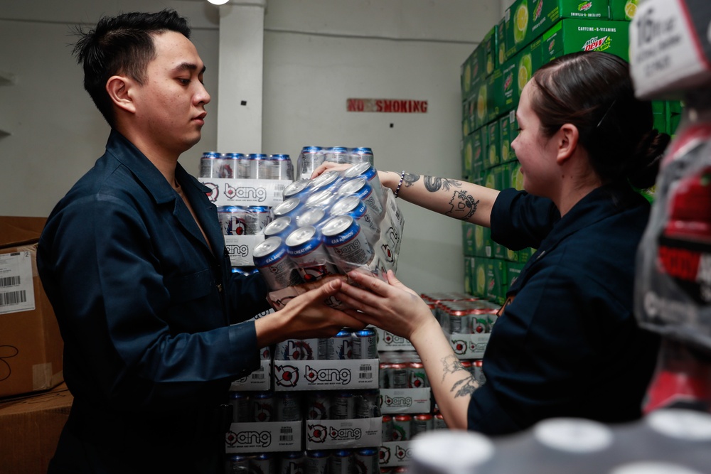 Abraham Lincoln Sailors restock ship's store