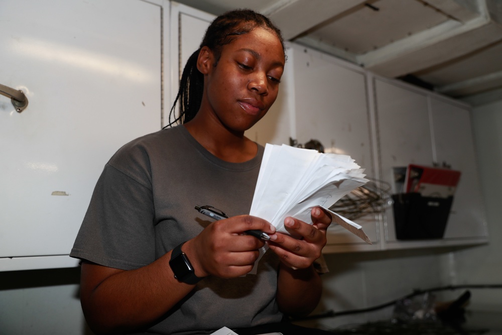 Abraham Lincoln Sailors restock ship's store
