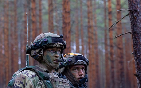 U.S. Army Staff Sgts. Ryan Cardiff and Devon Penrod communicate during Exercise Arrow 22