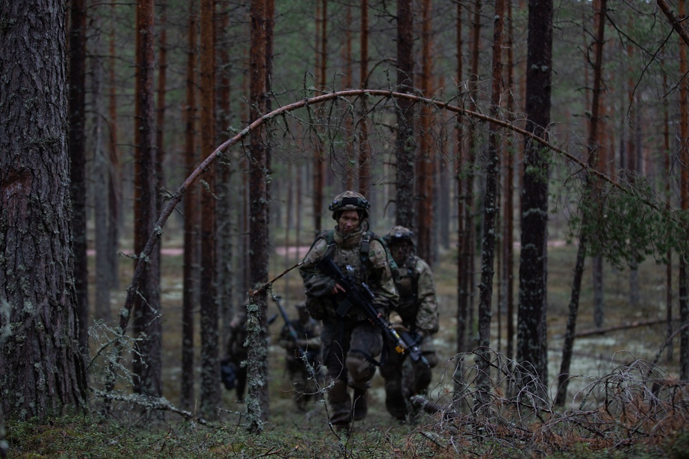 U.S. Army Spc. Kaitlin Ferguson bounds during Exercise Arrow 22