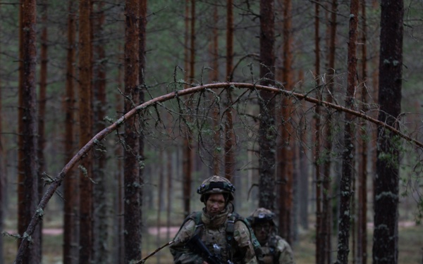 U.S. Army Spc. Kaitlin Ferguson bounds during Exercise Arrow 22