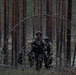 U.S. Army Spc. Kaitlin Ferguson bounds during Exercise Arrow 22