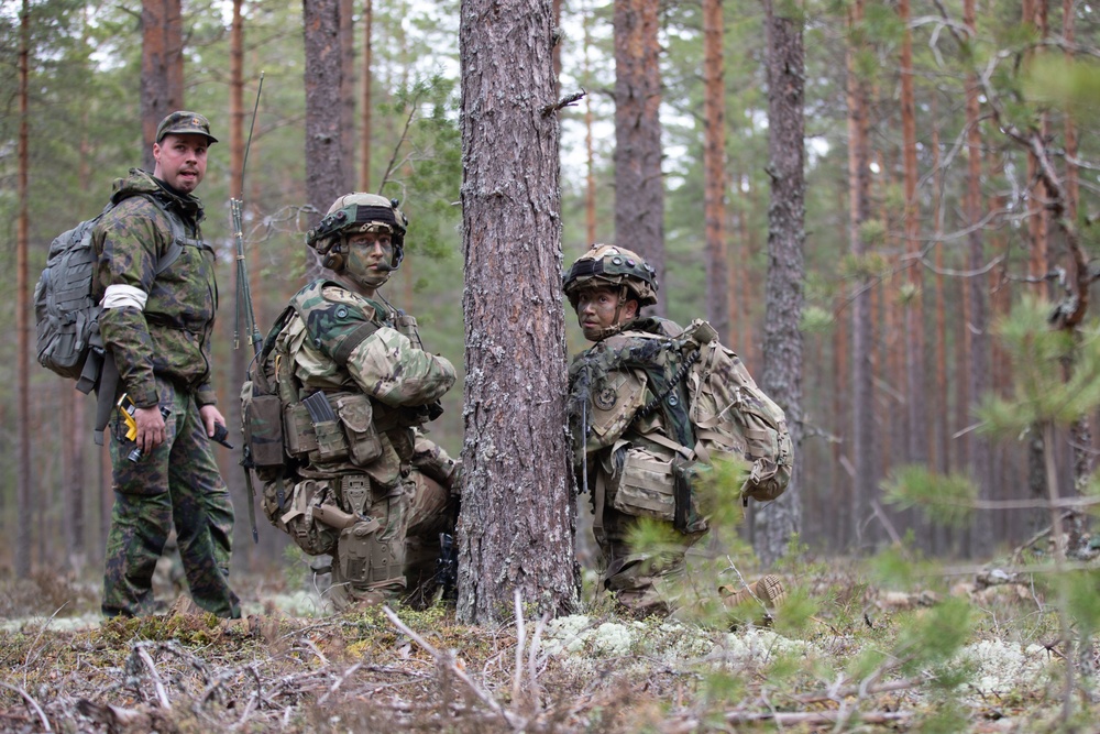 U.S. Army 1st Lt. Nicky Manitzas, right, and Staff Sgt. Ryan Cardiff, center, during Exercise Arrow 22