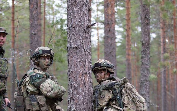 U.S. Army 1st Lt. Nicky Manitzas, right, and Staff Sgt. Ryan Cardiff, center, during Exercise Arrow 22