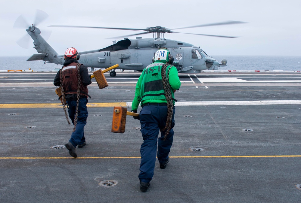 Sailors Run To Chalk Down MH-60R On The Flight Deck