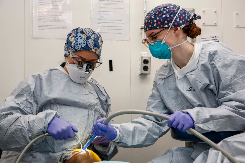 Abraham Lincoln Sailors perform dental procedures