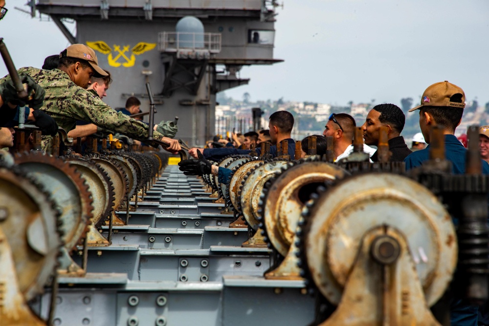 Sailors Remove an Aircraft Catapult