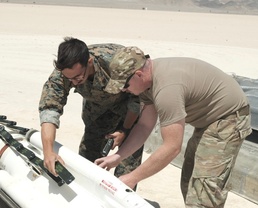 Joint service EOD techs join forces to destroy 12,000-pound missile cache