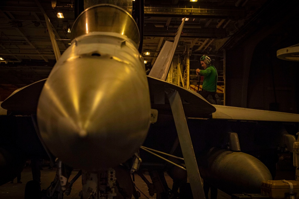 Sailor Performs Maintenance On An F/A-18E Super Hornet