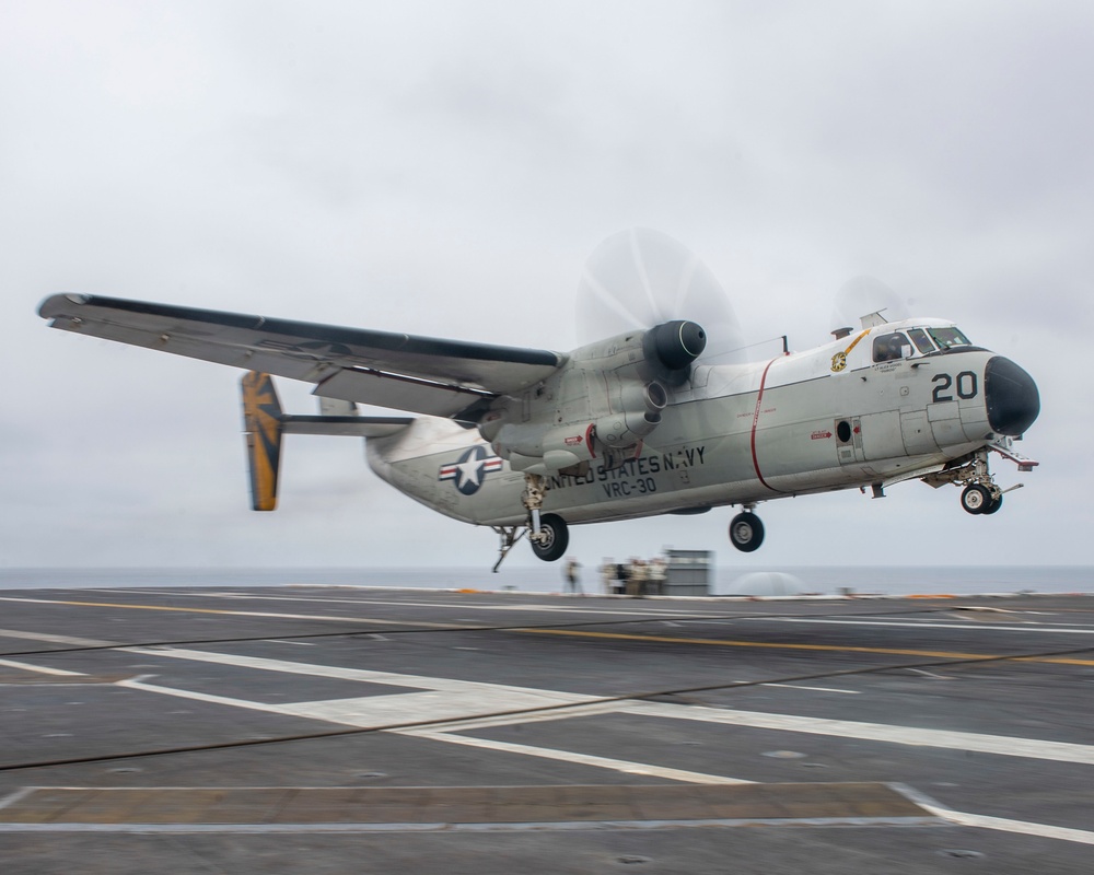 A C-2 Greyhound Makes An Arrested Gear Landing On The Flight Deck