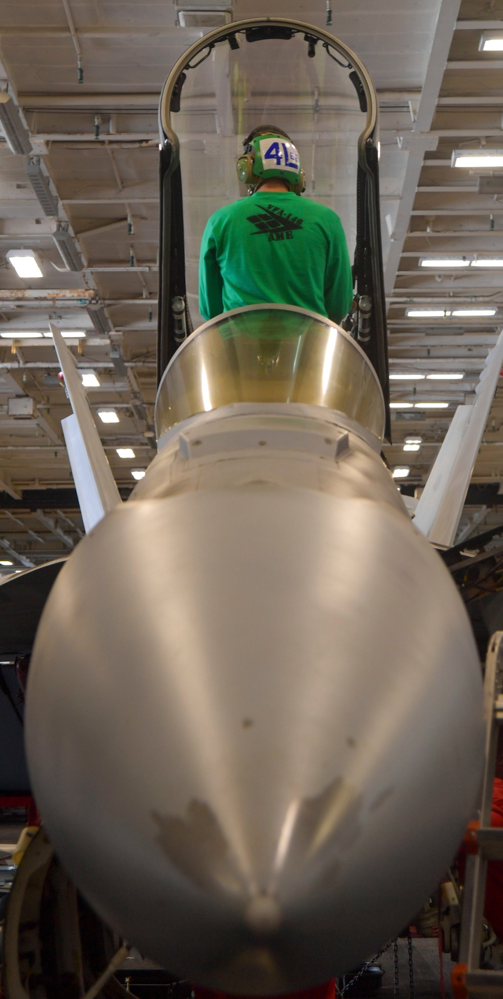 Sailor Performs Maintenance On An FA/18E Super Hornet