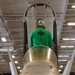 Sailor Performs Maintenance On An FA/18E Super Hornet