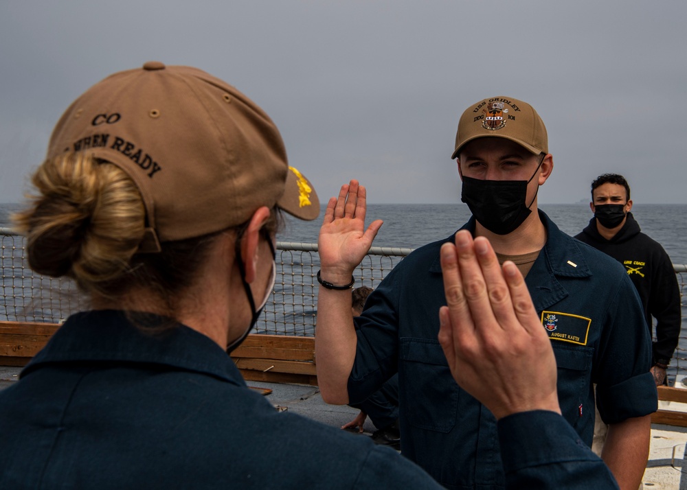 Gridley conducts a promotion ceremony on the ship's flight deck