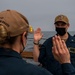 Gridley conducts a promotion ceremony on the ship's flight deck