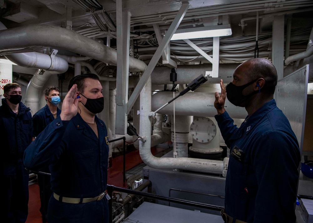 Gridley conducts a promotion ceremony in a main engine room