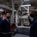 Gridley conducts a promotion ceremony in a main engine room