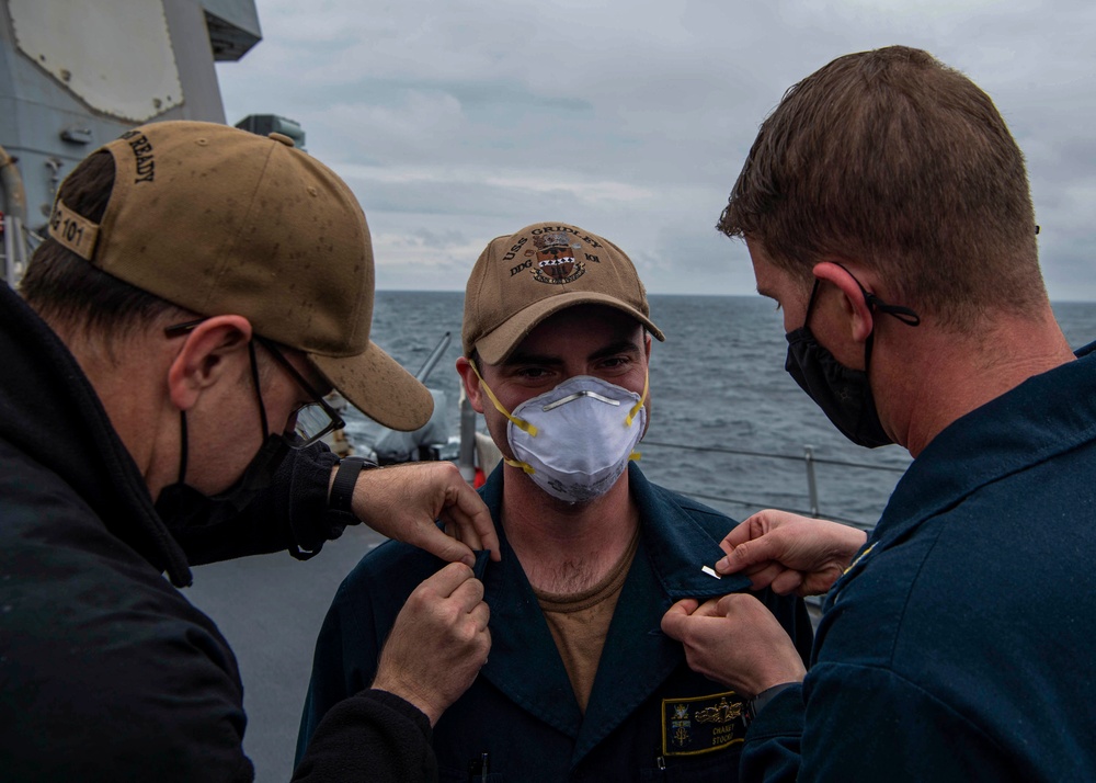 Gridley conducts a promotion ceremony on the ship's forecastle