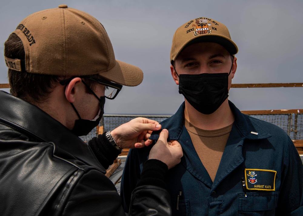 Gridley conducts a promotion ceremony on the ship's flight deck