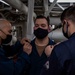 Gridley conducts a promotion ceremony in a main engine room