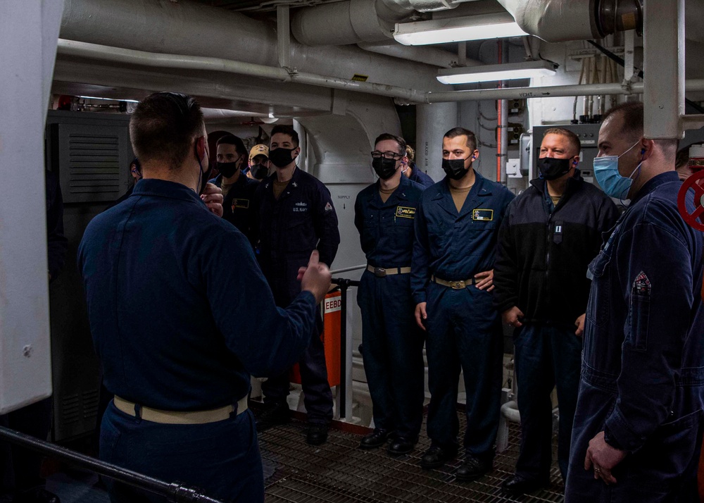 Gridley conducts a promotion ceremony in a main engine room