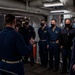 Gridley conducts a promotion ceremony in a main engine room