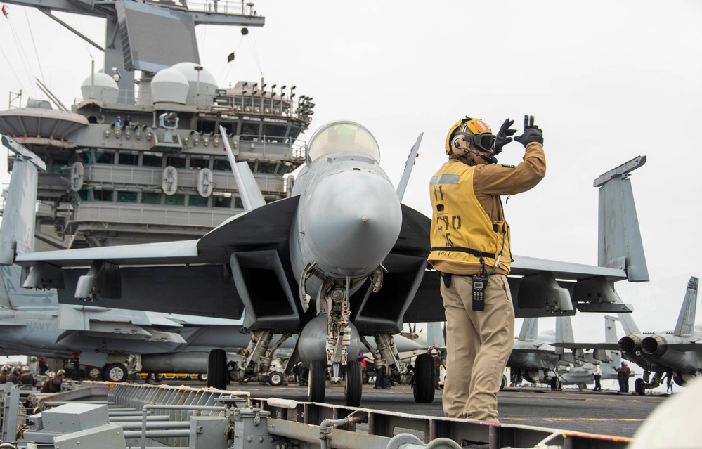 Sailor Directs An F/A-18E Super Hornet