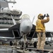 Sailor Directs An F/A-18E Super Hornet