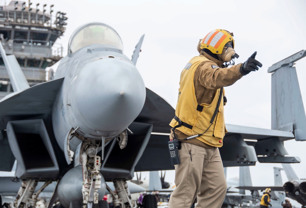 Sailor Directs An F/A-18E Super Hornet