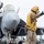 Sailor Directs An F/A-18E Super Hornet