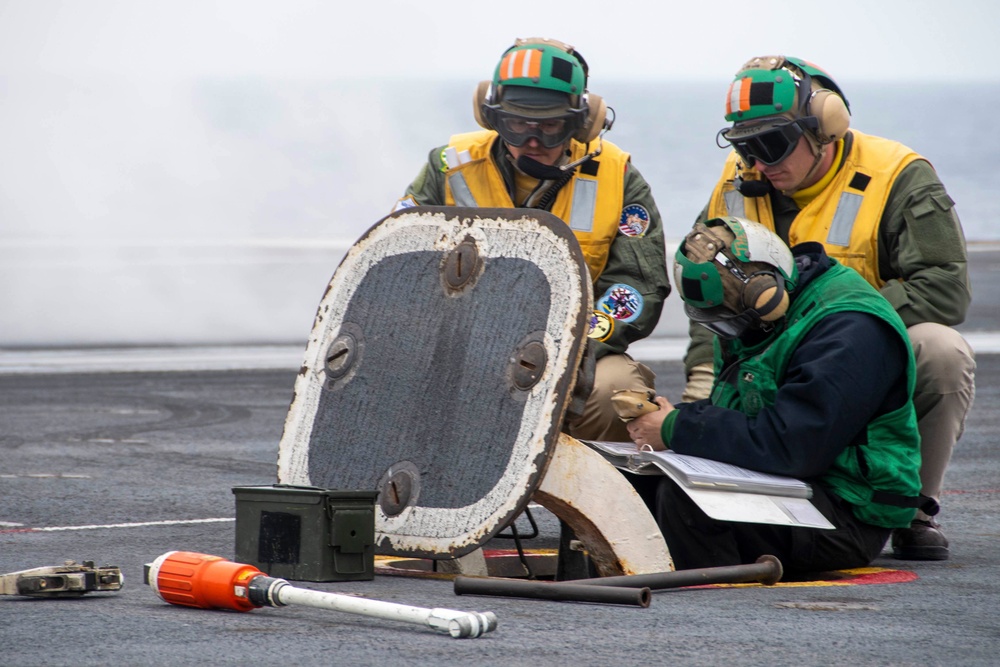 Sailors Prepare Catapult To Launch An Aircraft